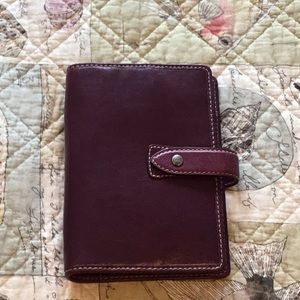 Filofax personal organizer, purple, with inserts.